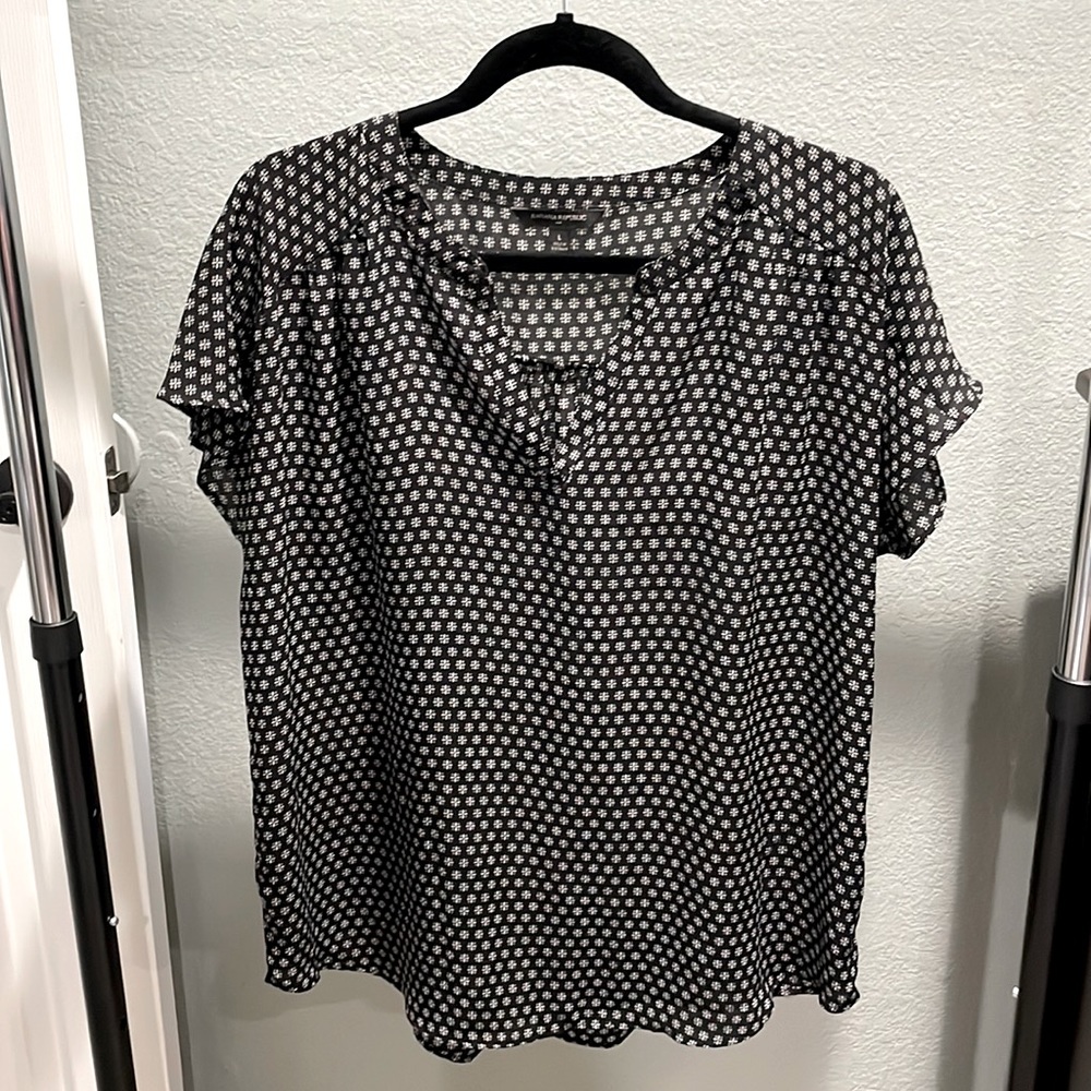 Black blouse with white floral pattern